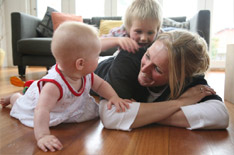 Mum and children playing on the floor